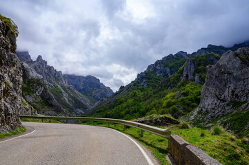 Fototapeta na wymiar Driving narrow mountain road from Los Arenas to remote mountain village Sotres, Picos de Europa mountains, Asturias, North of Spain