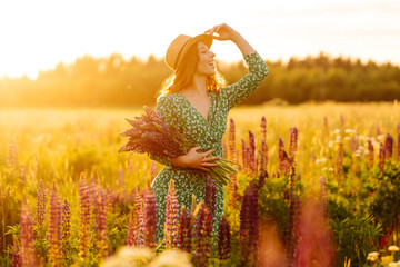 Beautiful woman in the blooming lavender field. Nature, vacation, relax and lifestyle. Summer landscape.