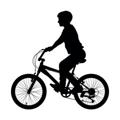 Fototapeta na wymiar Little boy riding bicycle side view silhouette.