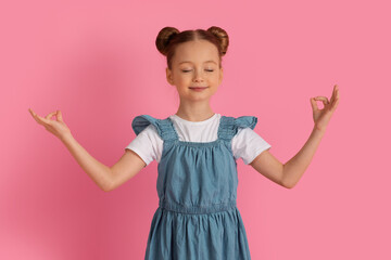 Zen. Cute Little Girl Meditating With Closed Eyes Over Pink Background