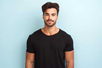 Fototapeta premium Portrait of a muscular handsome guy wearing a plain t-shirt, isolated on a pastel background. Generative AI illustration.