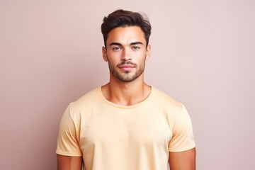 Portrait of a muscular handsome guy wearing a plain yellow t-shirt, isolated on a pastel background. Generative AI illustration.