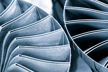 Steel blades of turbine propeller 3D printing. Close-up view. Selected focus on foreground,...