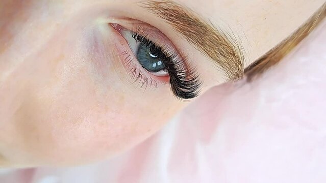 Close up of eye with eyelash extensions ,beauty salon treatment ,2d volume, 3d volume, classical lashes,Russian volume,megavolume, new set