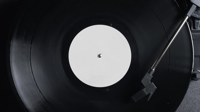 Close up of a vintage retro vinyl record rotating. Old fashioned music. Needle gramophone. 4K ProRes