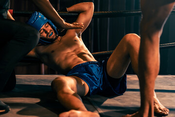 Boxing referee intervene, halting the fight to check fallen competitor. Intense and fierce boxing...