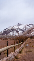 Fototapeta na wymiar Wooden Fence in the snowed Andes mountains.