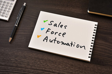 There is notebook with the word Sales Force Automation. It is as an eye-catching image.