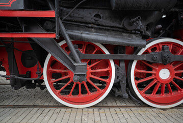 Fototapeta na wymiar red and black retro train wheels close up