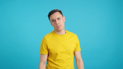 Man shaking his head and looking at the camera