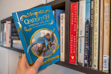 Naklejka premium Calgary, Alberta - June 17, 2023: Cover of J.K. Rowlings Quidditch Throught the Ages.