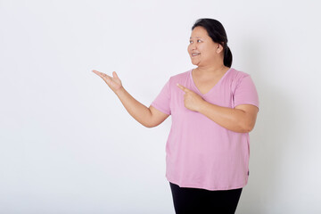 Beautiful Asian plus-size woman smiles with positive emotion, feeling happy and proud of her body overweight. Portrait shot on white background with copy space.