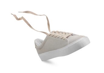 One stylish beige sneaker isolated on white