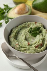 Delicious guacamole served on white table, closeup