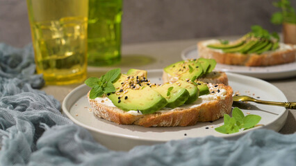 Toast with avocado cream cheese and wheat bread