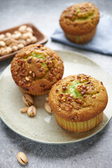 pistachio muffins on a plate