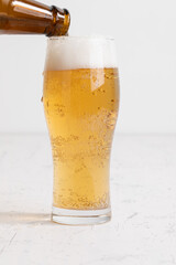 グラスに注がれるビール　beer being poured into a glass