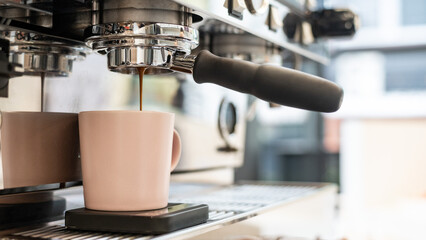 Coffee cup on black table, shallow depth of field.