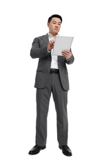 Businessman in suit using tablet on white background, low angle view