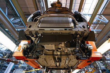 Production line assembles modern passenger car at plant