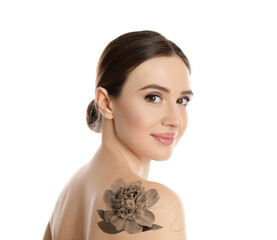 Fototapeta premium Smiling young woman with beautiful flower tattoo on white background