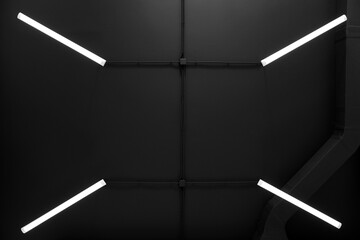 Black ceiling with modern lighting in room, bottom view