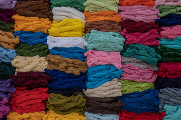 Background from colored yarn., Çlose-up. Materials for needlework. Rack with yarn in the store. 