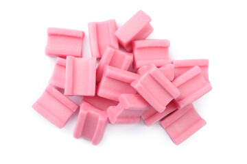 Pile of tasty pink chewing gums on white background, top view