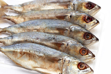Salted fish on white background.