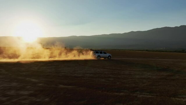 Dust From Vehicle Speeding On Arid Landscape In Sayula, Jalisco, Mexico. aerial FPV