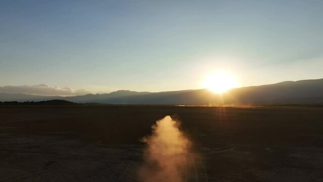 Dusty Trail Of An Off-road Vehicle Driving In The Terrain In Sayula, Jalisco, Mexico. - aerial