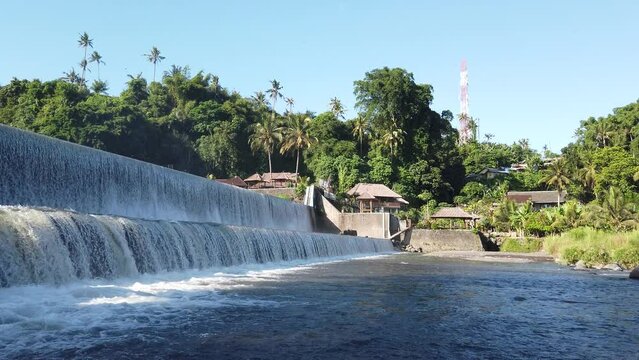 Large Wide Dam Water in Klungkung Bali Indonesia, Waterfalls Tropical Landscape, Stream River, Greenery and Reservoir in Daylight