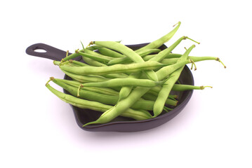 Green beans in the cooking pan isolated on white