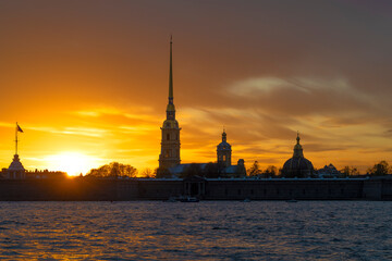 The ancient Peter and Paul Cathedral against the background of the gloomy May sunset. Saint Petersburg, Russia