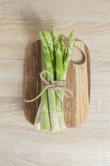 asparagus on a wooden table. healthy food concept. vertical photo