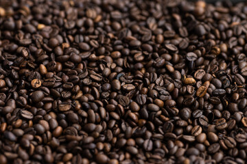 Macrophotography of roasted coffee beans.