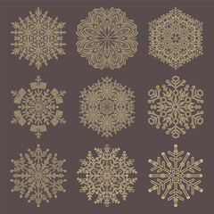 Set of vector snowflakes. Collection of brown and yellow winter ornaments. Snowflakes collection. Snowflakes for backgrounds and designs