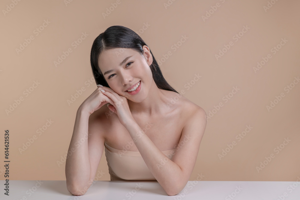 Wall mural Portrait of a young Asian woman with natural makeup and natural styling. Advertising natural cosmetics. Advertising for a beauty salon. Care cosmetics, face and body skin care.