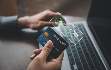 Digital wallet and credit card revolutionize shopping experience. Woman completes payment through laptop app for seamless money transfer