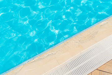 The side of the pool is made of ceramic granite with a sieve for water overflow.