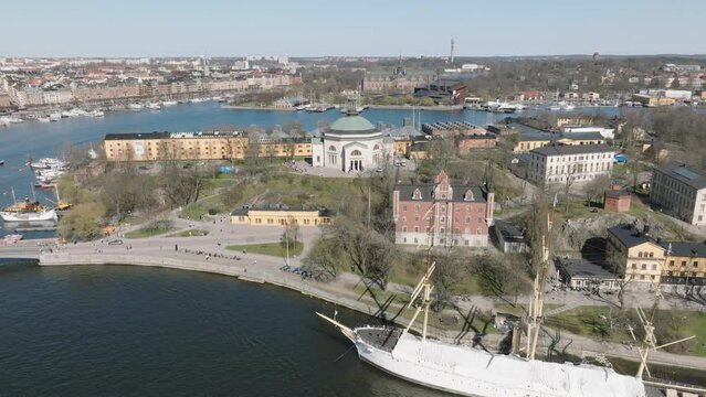 4K Aerial of Stockholm Historic City and Harbour Slowly Orbiting Around Eric Ericsonhallen