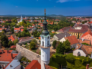 Veszprem, Hungary - Aerial view of the Fire-watch tower at Ovaros square, castle district of Veszprem with Reformed Church and medieval buildings at background on sunny summer day with clear blue sky