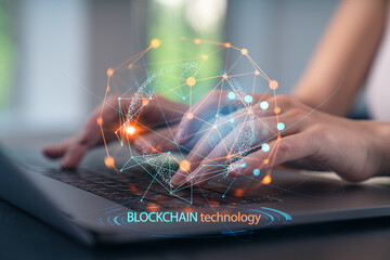 Woman typing on laptop at office workplace in background. Concept of working process, internet surfing, online business education. Student send e-mail. Close up view. Blockchain icons