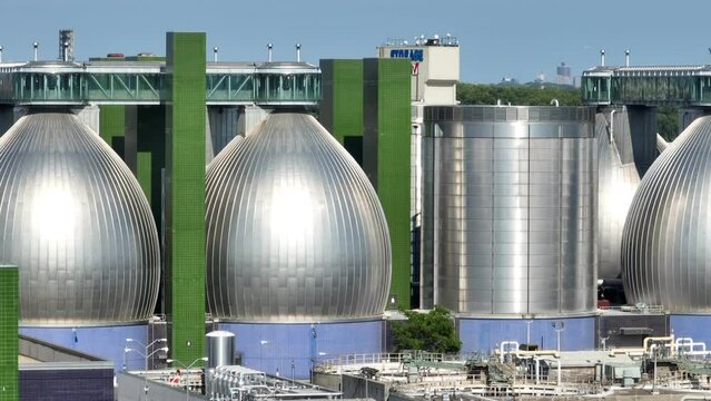 Digester Eggs at Newtown Creek Wastewater Treatment Plant. Long aerial zoom lens. Sludge digesters use anaerobic digestion to transform the sludge into fertilizer.