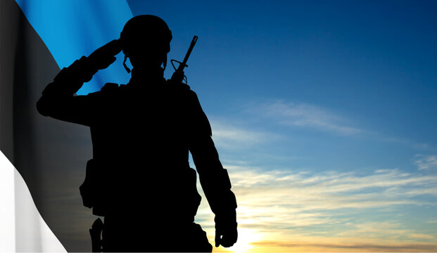 Silhouette of a saluting soldier on background of sky with Estonia flag. EPS10 vector