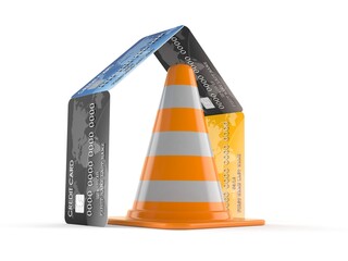Traffic cone inside house of credit cards