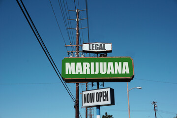 Aged and worn urban legal marijuana sign 