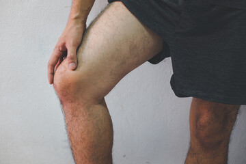 knee injury in humans .knee pain,joint pains people medical, mono tone highlight at knee
