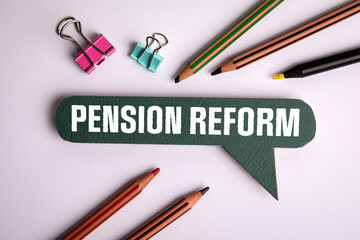 Pension Reform. Speech bubble with text on white office desk
