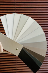 Samples of wooden blinds for windows in a store